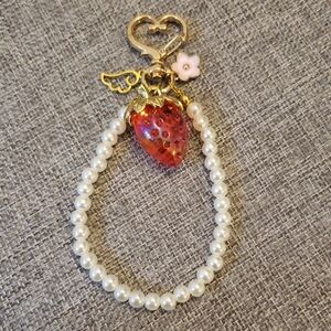 Charming Pearl Bag Charm with Strawberry and Gold Accents